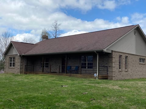 Front of home with large yard!  Plenty of outdoor space for the family to play. 