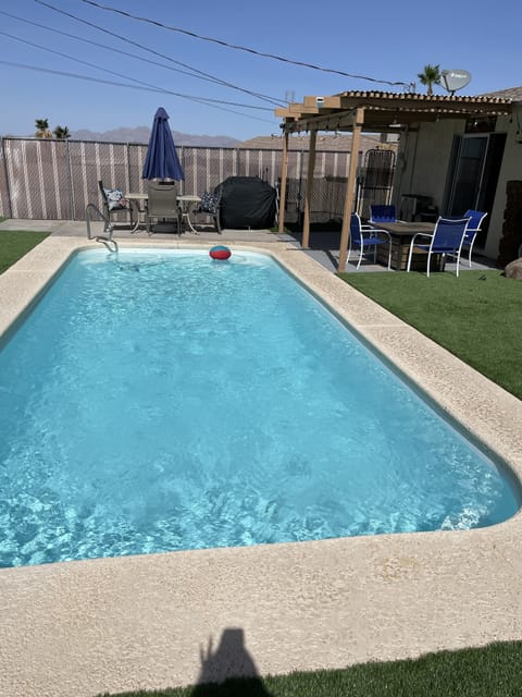 clean crystal clear pool w/landscaping in turf.