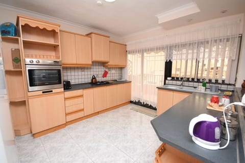 Large kitchen full of amenities