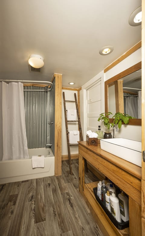 Bathroom in Farm House. Bathtub/shower combo. 