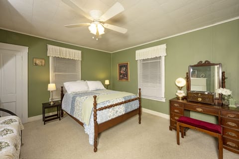 Comfortable full size bed and twin bed in 1887 West Virginia Farm House.