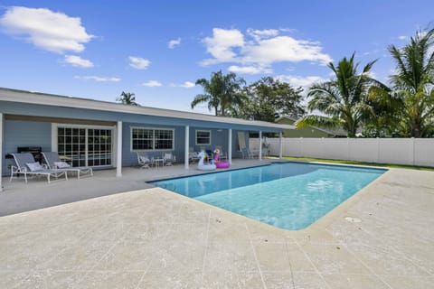 A view of the pool and house from the backyard.