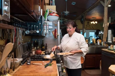 Chef Esther preparing delicious Italian food.