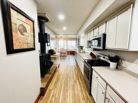 Spacious, fully stocked kitchen with ample counter space, modern appliances, and all the essentials you need to cook and dine. Perfect for preparing family meals or entertaining large groups during your stay.