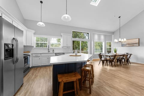The kitchen with lake view is stocked with pots, pans and utensils to prepare big meals for your famliy gatherings