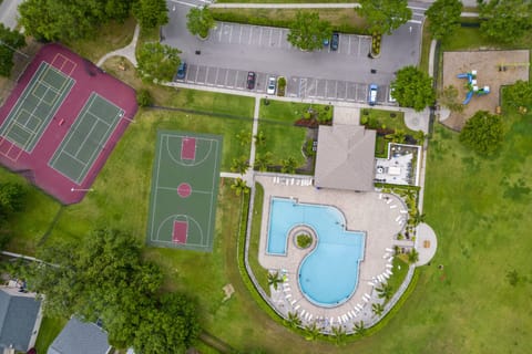 Step outside the gate and you've got it all — pool, basketball, tennis, and pickleball waiting.