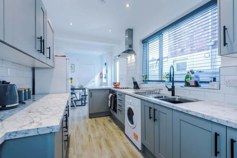 The fully equipped open plan kitchen/dining area has everything you need for a short and long term stay in Crewe.
