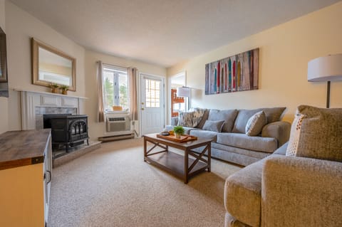 Living Room with Queen Sleeper Sofa, Fireplace, and 55" Smart TV