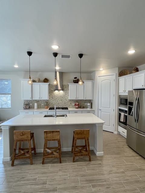 Kitchen with barstools in island