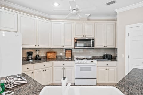 Large, open kitchen. Great for making memories and cooking family meals after a day at the beach or lounging around the pool.