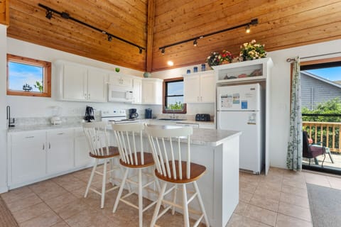 Whip up your favorite seafood spectacular in the modern Kitchen for everyone to enjoy in the sunny Dining Area.