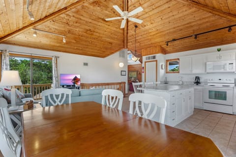 Whip up your favorite seafood spectacular in the modern Kitchen for everyone to enjoy in the sunny Dining Area.