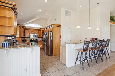 Whip up a delicious meal in the Modern Kitchen with stainless steel appliances, 2 Refrigerators, 2 Dishwashers, 2 Microwave Ovens, a Range, and a Wine Cooler.