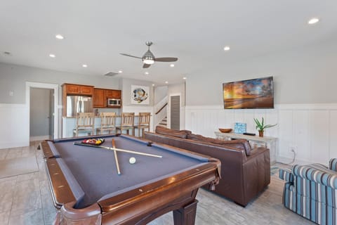 Head straight for the Game Room with a Pool Table and Flat Screen TV and enjoy a mixed drink and some snacks from the Wet Bar.