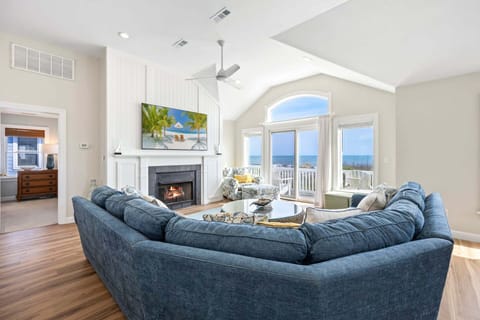 Relax on the Top Level with lots of natural light and brilliant views of the Atlantic Ocean. (New 75" TV & Redesigned Fireplace!)