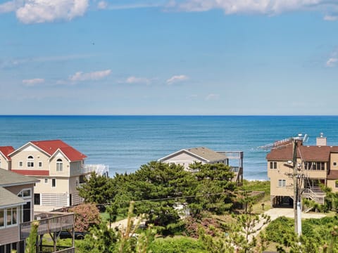 This classic 5-Bedroom, 4-Bathroom home in Duck is located on one of the best semi-oceanfront lots in the community.