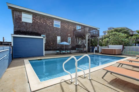The private swimming pool offers a refreshing place to cool off after a sunny day at the beach.