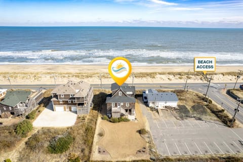 The Coastal Cottage sits on the west side of the beach road, offering unobstructed ocean views and just 175 feet from public beach access.