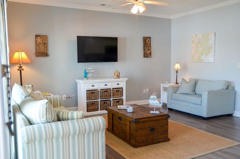 Bright and beachy living room with smart TV - cable and all of the apps