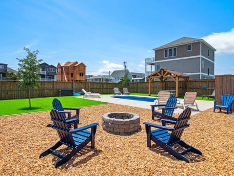 The backyard and pool area have been upgraded for the 2025 season to include a new putting green, new fire pit furniture, & more!