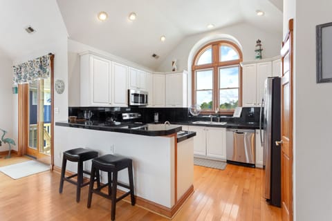 A modern kitchen comes fully stocked with everything you need to cook delicious meals in your own home on those nights you don't feel like venturing out, including a Keurig for early morning coffee.