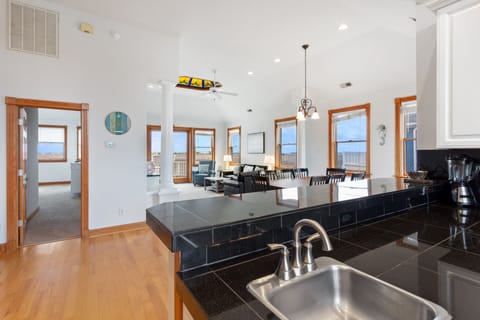 A modern kitchen comes fully stocked with everything you need to cook delicious meals in your own home on those nights you don't feel like venturing out, including a Keurig for early morning coffee.