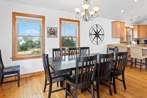 Dining Area: Enjoy family meals around the elegant dining table with seating for ten.