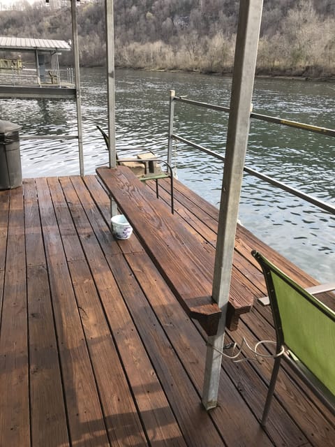 Floating fishing dock, fishing platform with deck chairs.