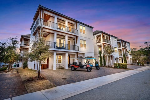2 Golf Carts FREE during your stay! 2 minutes to the beach.  Sleeps 20, 8 bedrooms, 7 bath, and 13 beds.  Game room and bunk rooms. Heated pool steps from the house!