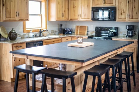 Your friends and family will gather around this  4' x 8' granite bar, the heart and hub of the home. Imagine all the food and fun that will be served at this bar. Come make memories that will last for years to come.  Come and get it!