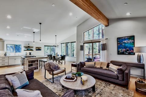 Chic living area with a sleek couch and modern table ideal for quiet moments or casual conversation.
