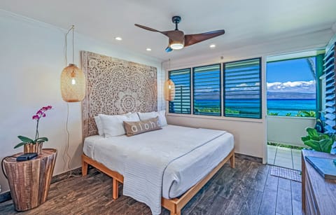 Plush King bed with views of Napili Bay