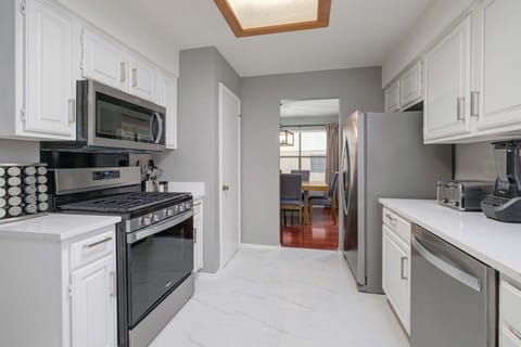 Clean, spacious kitchen connects seamlessly to dining and living areas for effortless entertaining and everyday comfort.