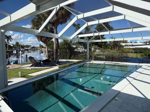 Screened pool with canal views