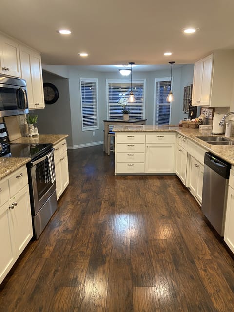View of kitchen and seating.
