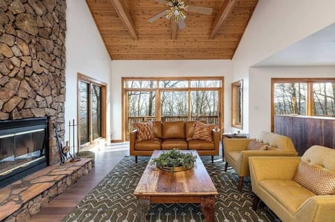The spacious living room with mountain views all around.