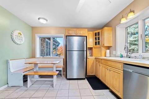 kitchen dining area, dishwasher, childrens dishes.