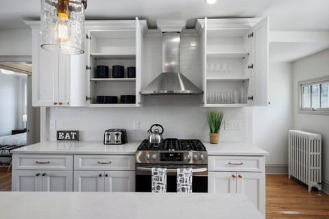 Kitchen is fully stocked with tableware, glassware, etc..