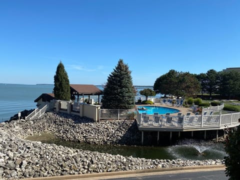Relaxing on your private balcony 😎.  Pool opens mid May