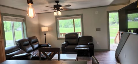 Living Room with plenty of comfortable seating and 50 inch SmarTV