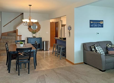 Living room view to dining room and kitchen