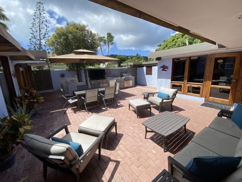 Summer kitchen w retractable shade awnings