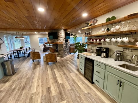 Coffee bar with every way to make coffee that you want. 12 cup brew, coffee bean grinder full of beans, keurig machine, pour over, French press.