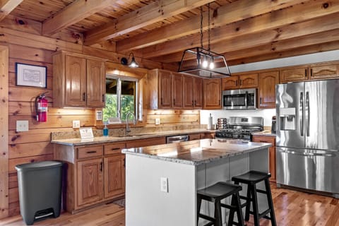 The beautiful kitchen with all new lighting & plenty of space to prepare meals.