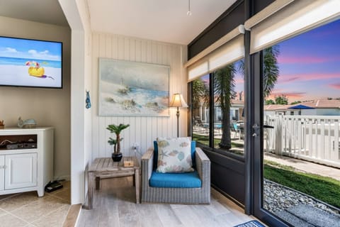 The sunroom off the living room has private access to the heated swimming pool, BBQ & clubhouse areas.