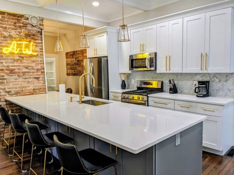 The kitchen has a huge island for cooking and entertaining