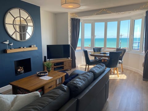 Comfy living dining space with sea views