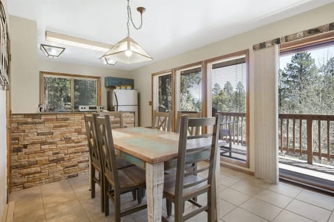 Seating for six at this table with a great view of the green space that surrounds the home. You will often see a family of turkeys and deer in the mornings. 