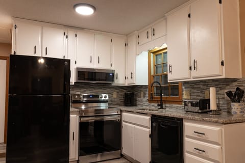 Fully equipped kitchen with granite counter tops & upgraded fixtures.