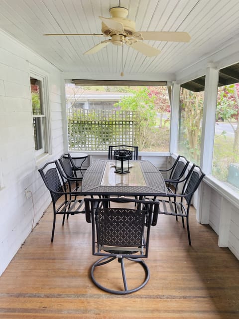 Great ocean breezes on front screen porch with dining area.  